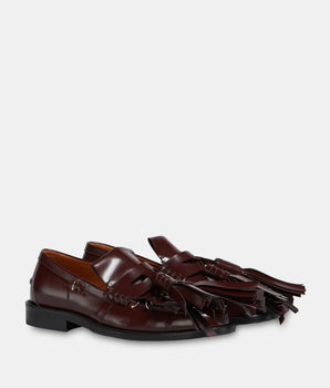 Leather loafers with fringed pompoms